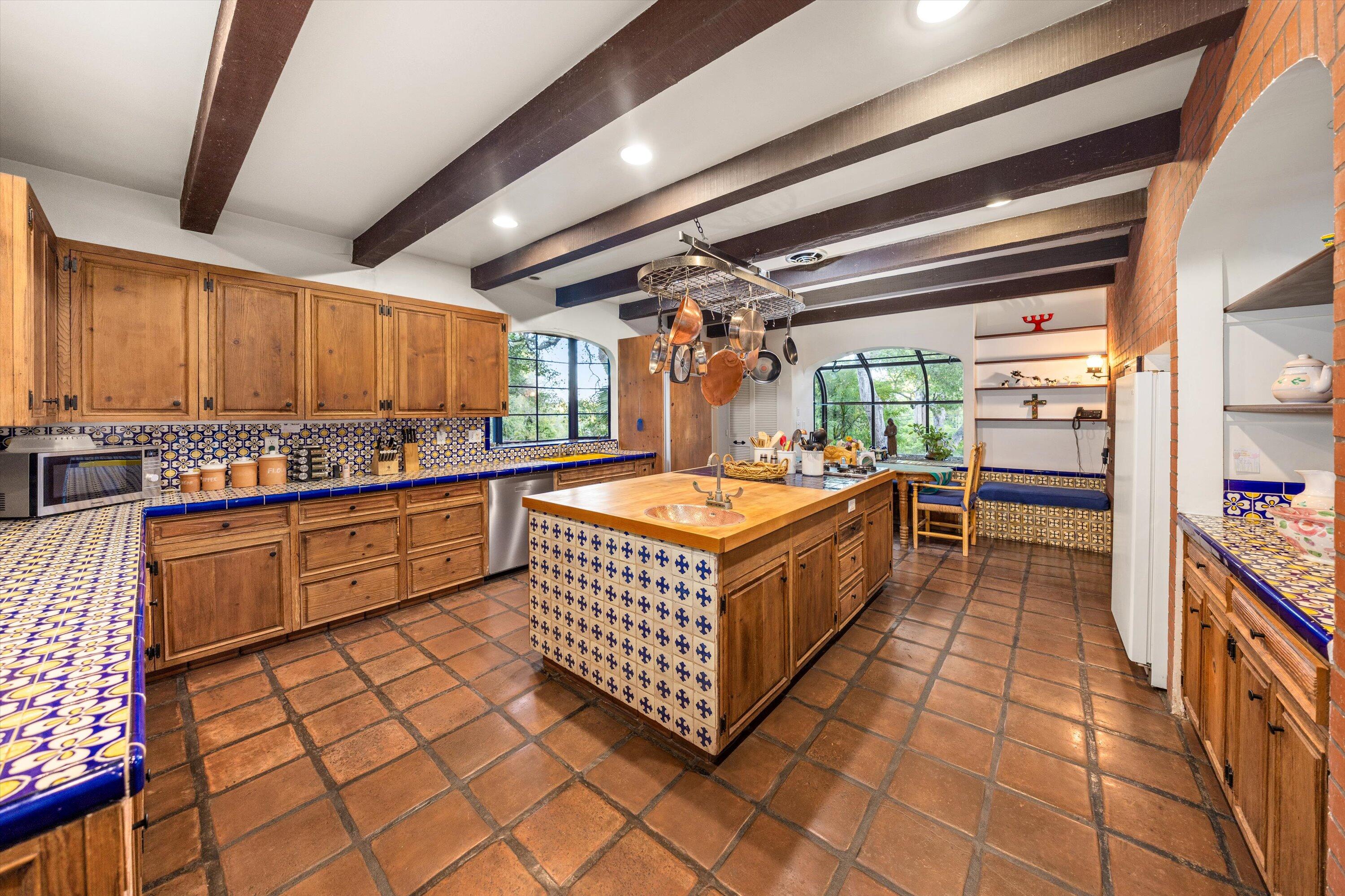 725 Ashley Road Montecito, CA 93108 - Photo 15 of 29 a kitchen with stainless steel appliances granite countertop a stove a sink and cabinets