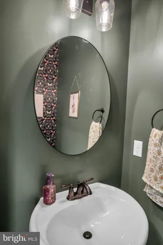 a bathroom with a sink and mirror