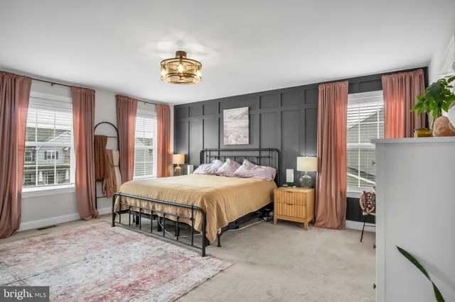 a bed room with a bed and a window