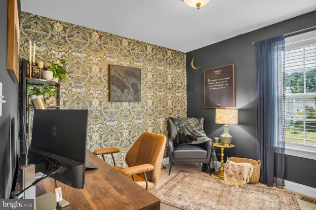 a workspace with furniture and a window