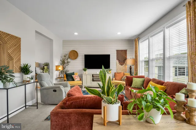 a living room with furniture fireplace and flat screen tv