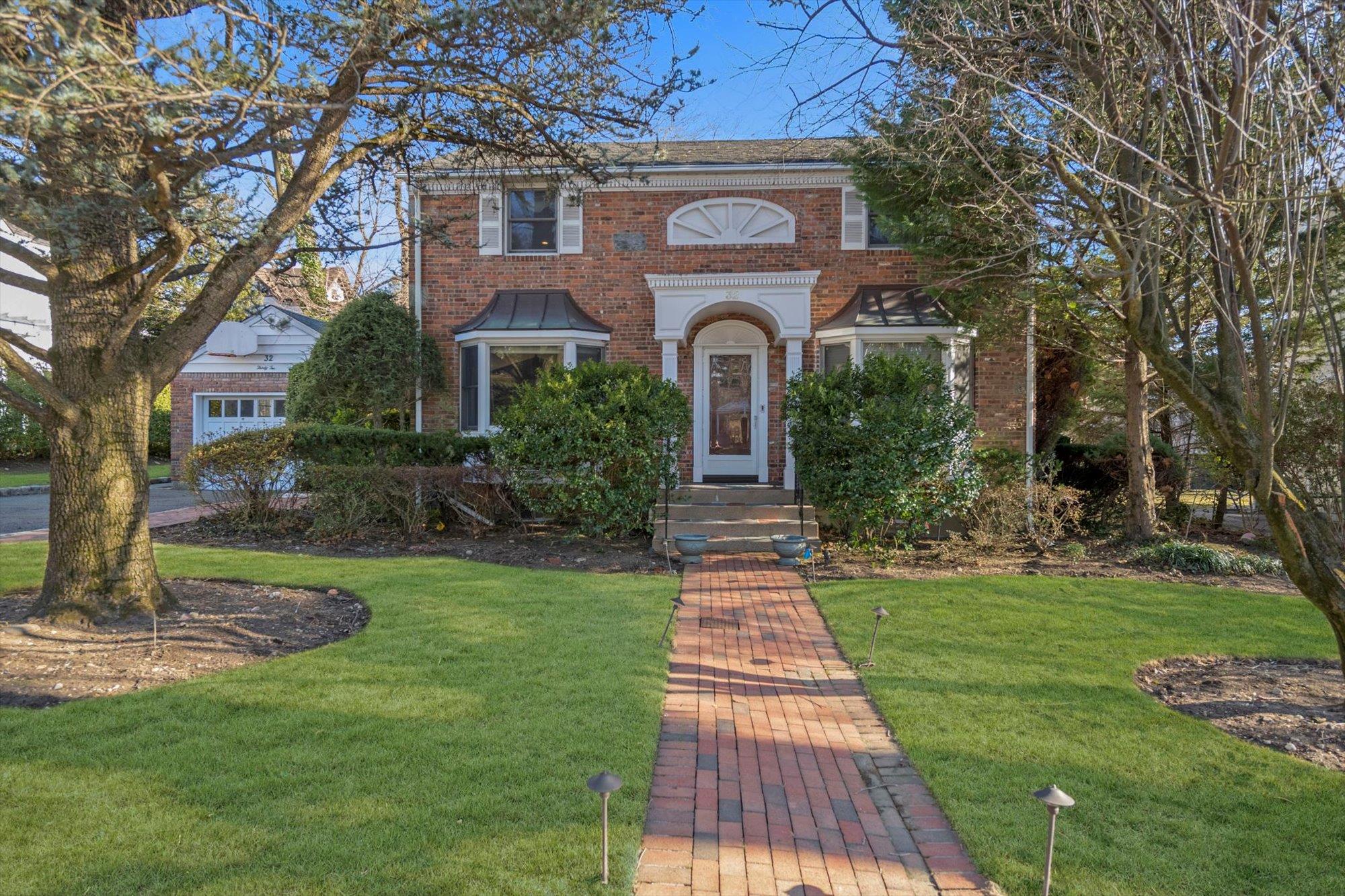 32 Cedar Drive Great Neck, NY 11021 - Photo 1 of 1 a front view of a house with a yard