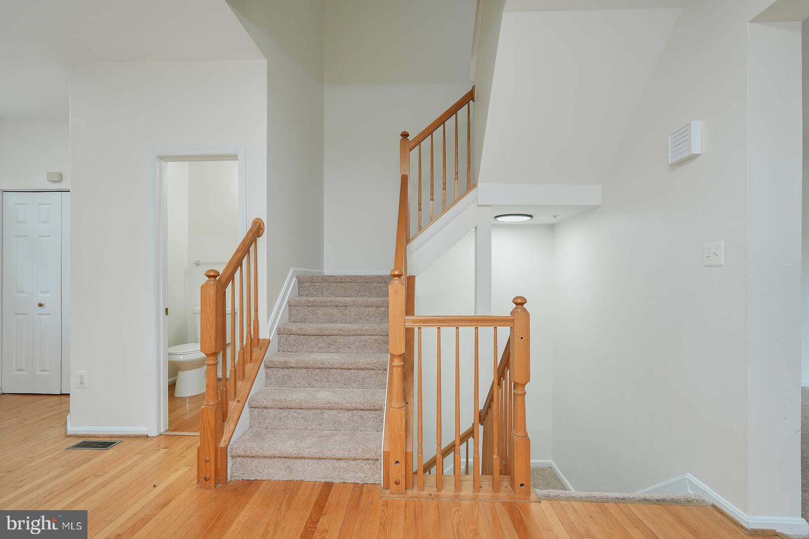 7802 Canter Court Severn, MD 21144 - Photo 16 of 41 a view of entryway with wooden floor