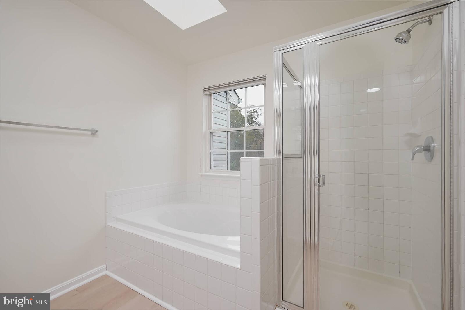 7802 Canter Court Severn, MD 21144 - Photo 20 of 41 a bathroom with a shower and a bath tub