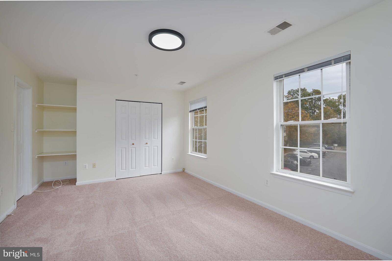 7802 Canter Court Severn, MD 21144 - Photo 27 of 41 a view of an empty room with a window