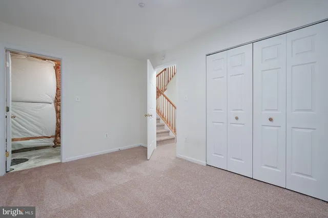 an empty room with staircase