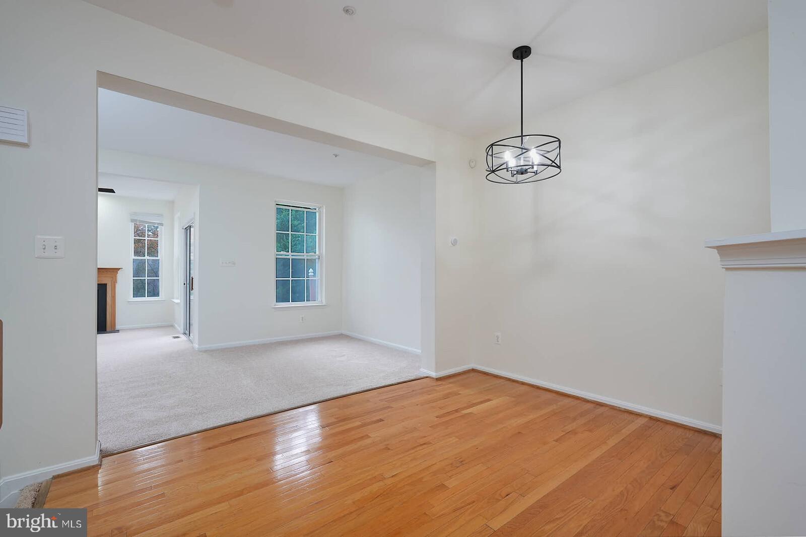 7802 Canter Court Severn, MD 21144 - Photo 10 of 41 a view of empty room with wooden floor