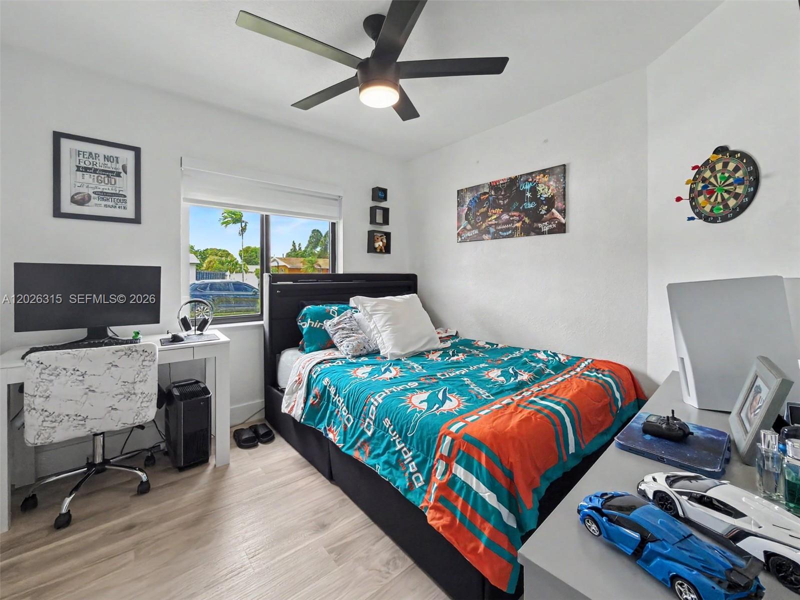 10762 Southwest 145th Street Miami, FL 33176 - Photo 12 of 28 a bedroom with a bed and a flat screen tv