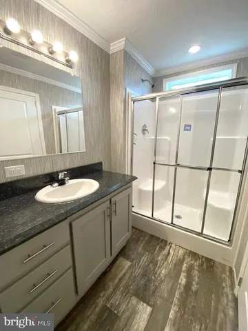 a bathroom with a double vanity sink and mirror