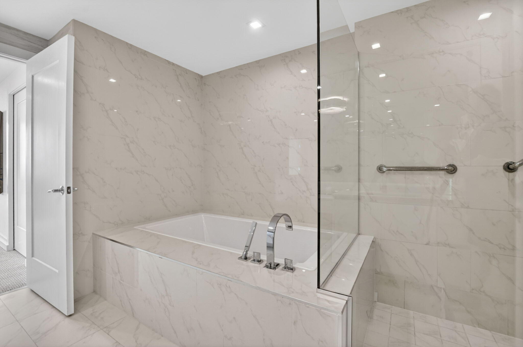 20155 Boca W Drive, Unit B701 Boca Raton, FL 33434 - Photo 25 of 78 a bathroom with a bathtub and a shower