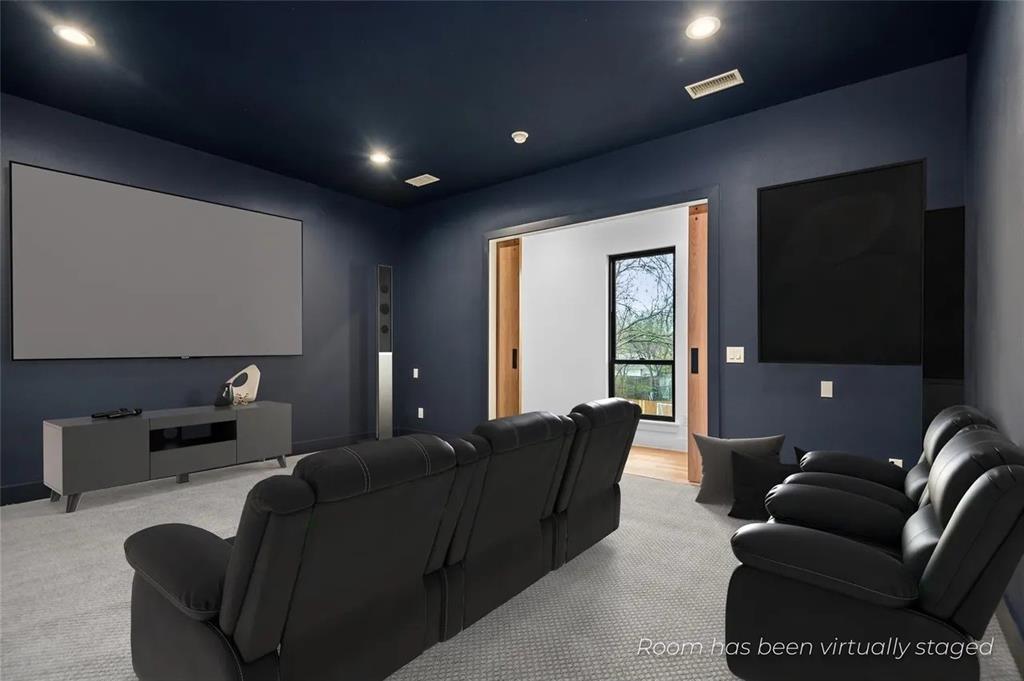 309 Kaye Street Coppell, TX 75019 - Photo 25 of 36 Media room featuring a large projection screen, recessed lighting, and a dark-painted ceiling