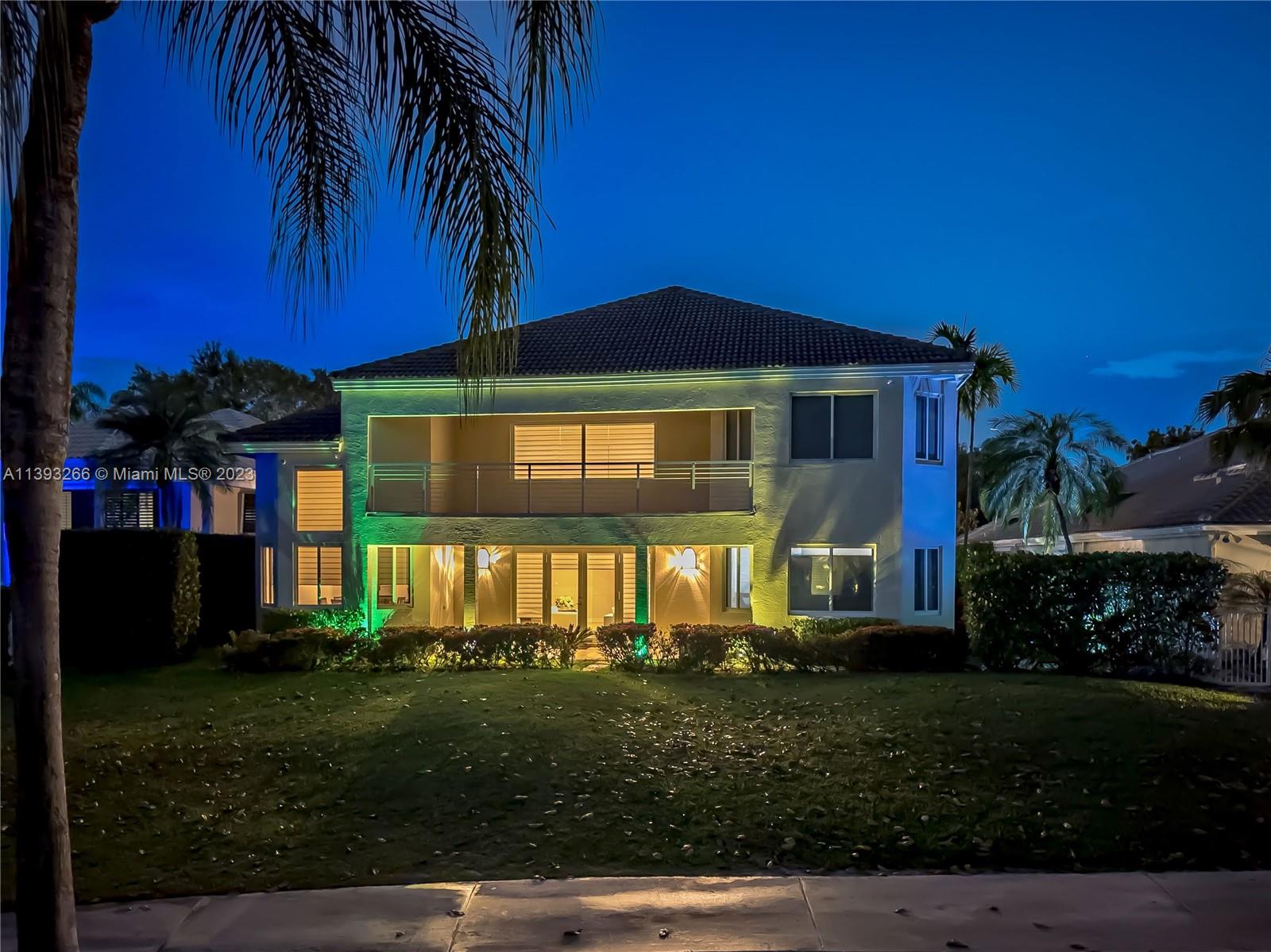 2707 Pinehurst Drive Weston, FL 33332 - Photo 13 of 59 a front view of a house with a yard