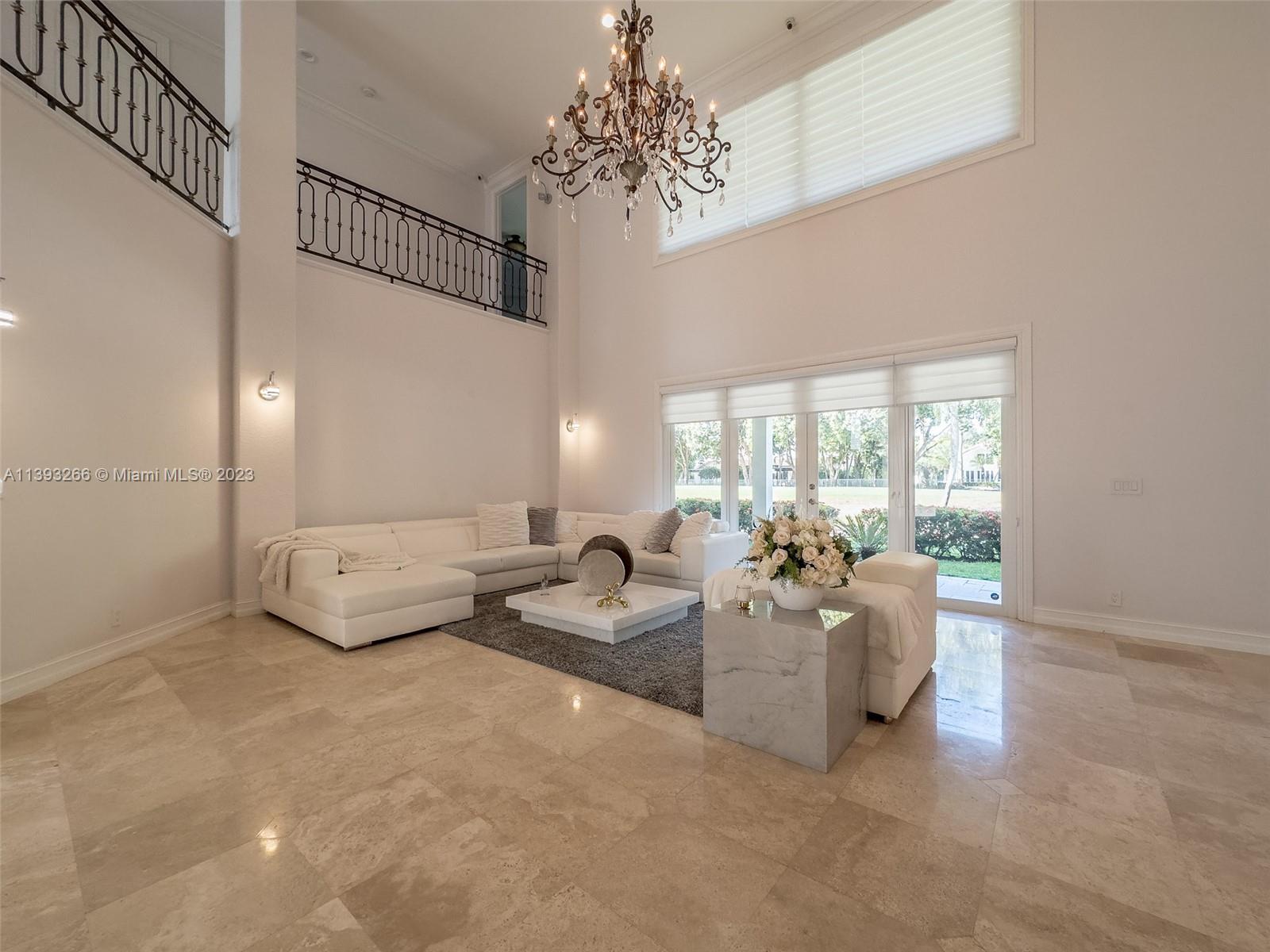 2707 Pinehurst Drive Weston, FL 33332 - Photo 15 of 59 a living room with furniture and a chandelier