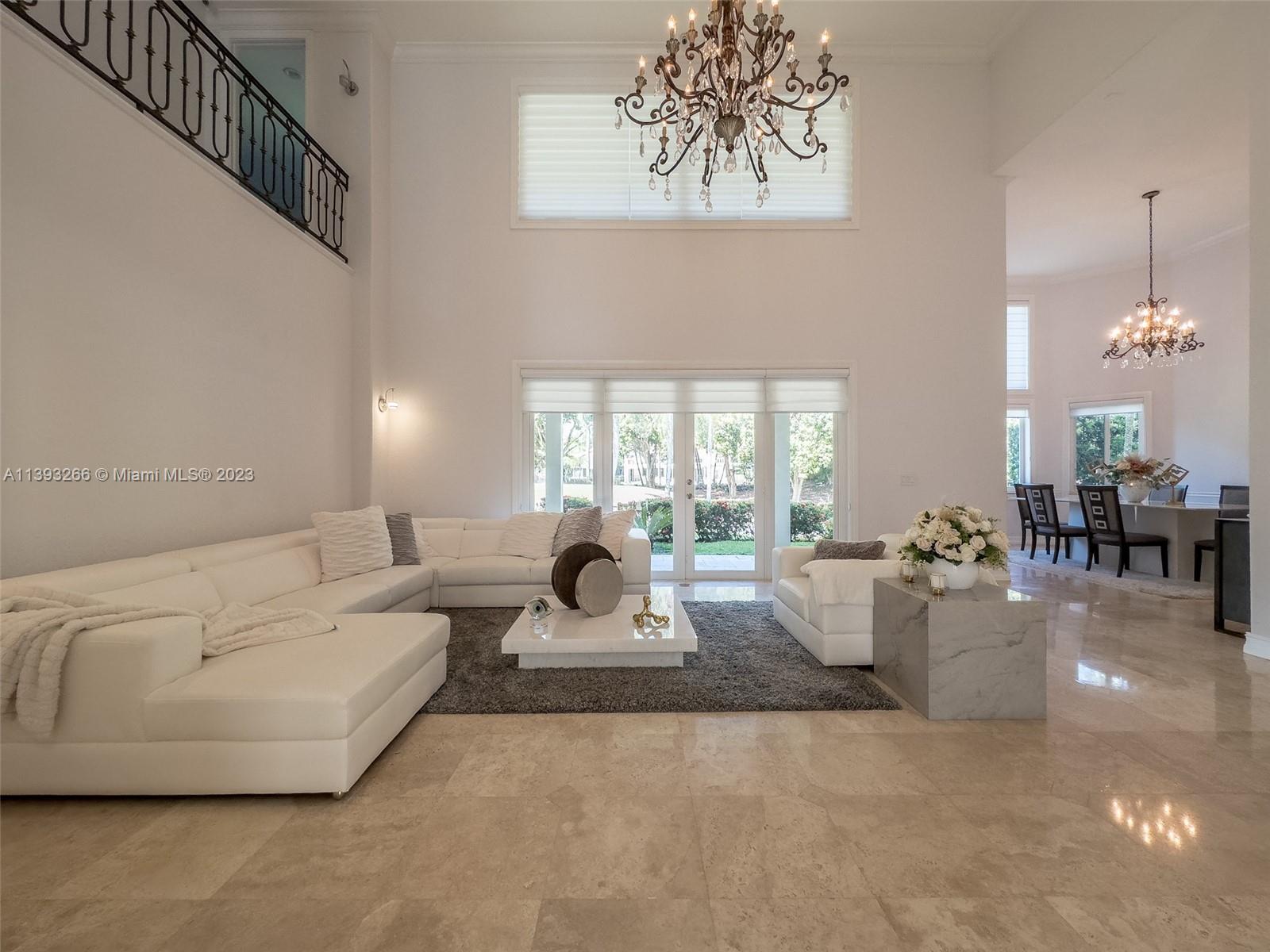 2707 Pinehurst Drive Weston, FL 33332 - Photo 16 of 59 a living room with furniture and a chandelier