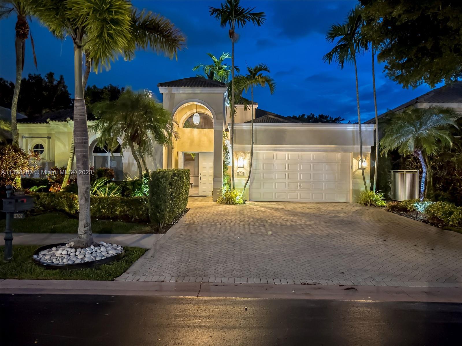 2707 Pinehurst Drive Weston, FL 33332 - Photo 2 of 59 a view of a house with a yard and tree s