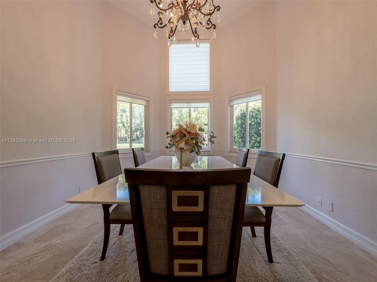 2707 Pinehurst Drive Weston, FL 33332 - Photo 22 of 59 a view of a dining room with furniture and window