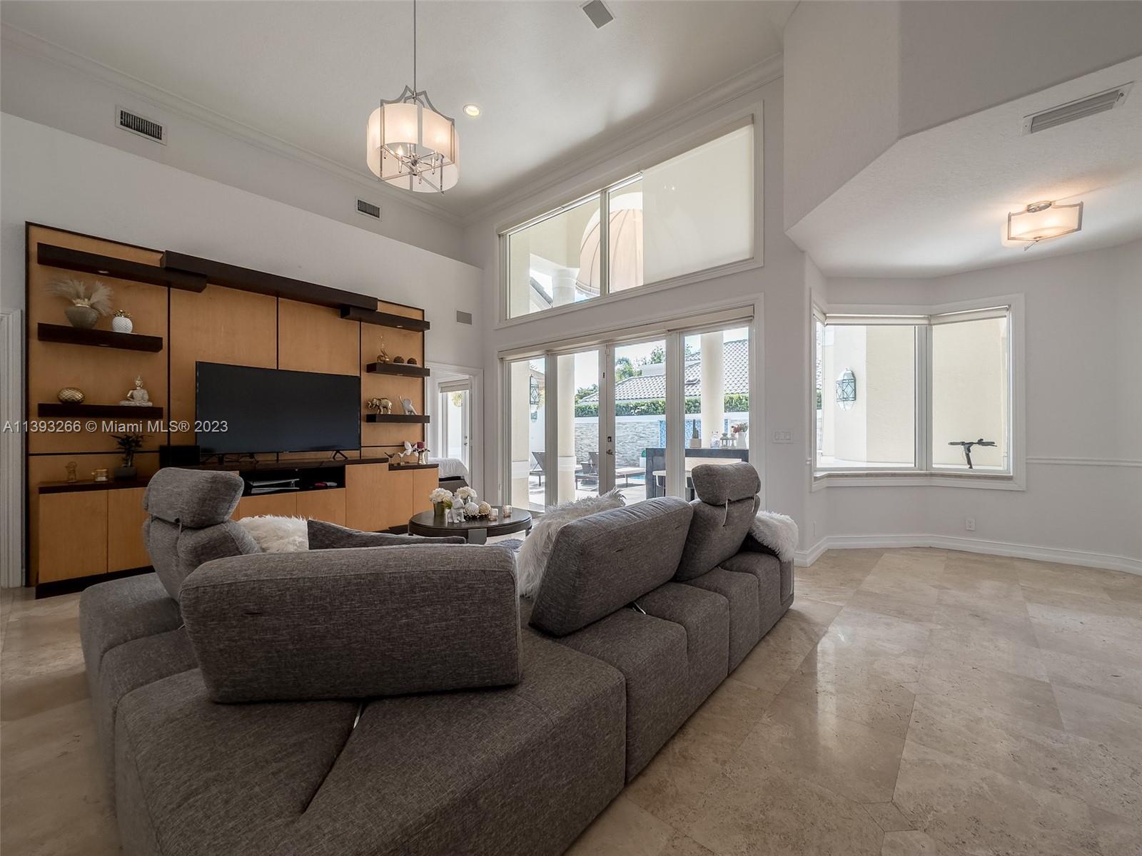 2707 Pinehurst Drive Weston, FL 33332 - Photo 28 of 59 a living room with furniture and a flat screen tv