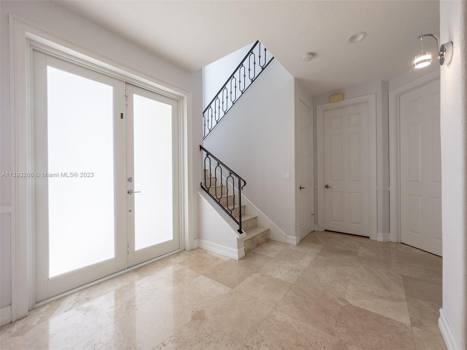 2707 Pinehurst Drive Weston, FL 33332 - Photo 31 of 59 a view of an entryway with staircase