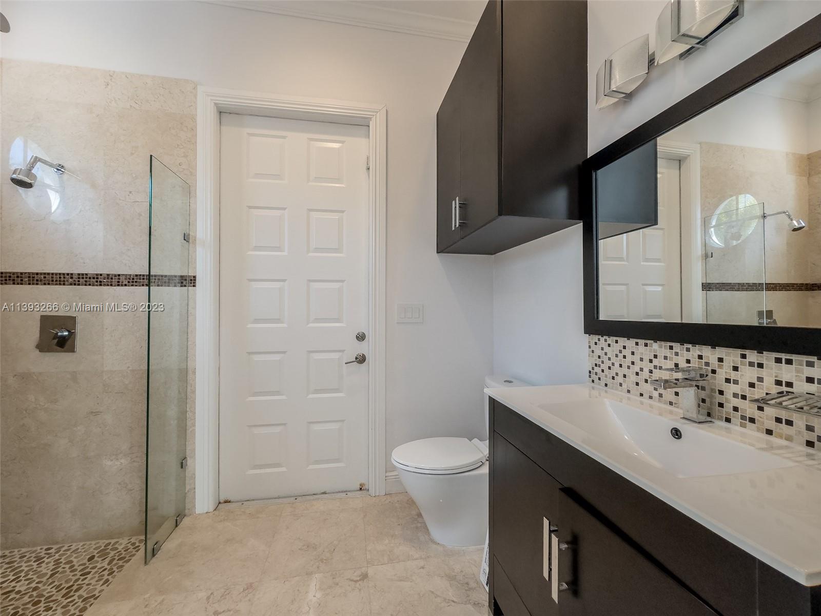 2707 Pinehurst Drive Weston, FL 33332 - Photo 41 of 59 a bathroom with a sink a toilet and shower