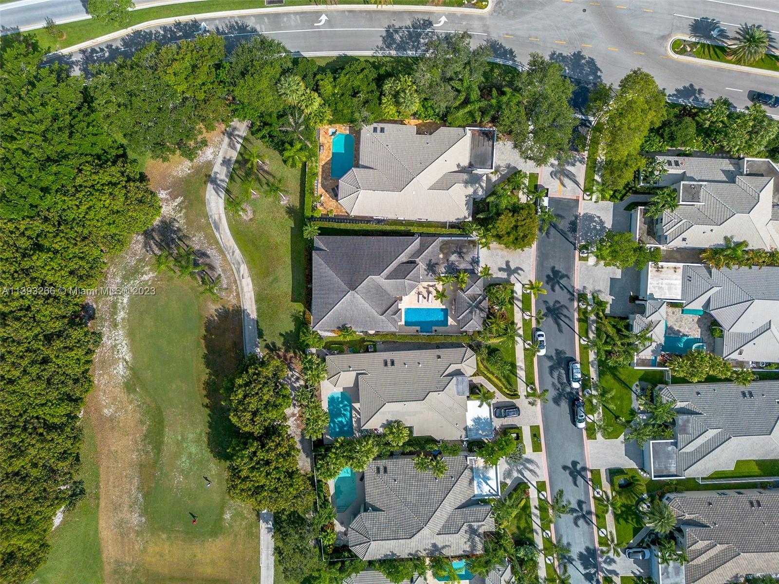 2707 Pinehurst Drive Weston, FL 33332 - Photo 47 of 59 an aerial view of a house with a garden and trees
