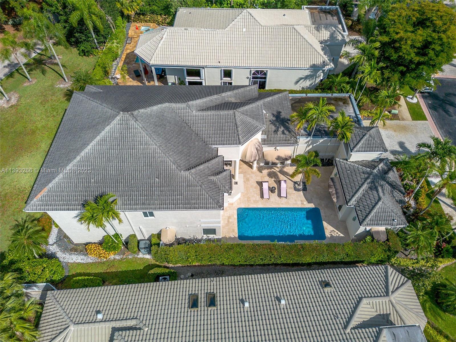 2707 Pinehurst Drive Weston, FL 33332 - Photo 48 of 59 an aerial view of a house with a yard and potted plants