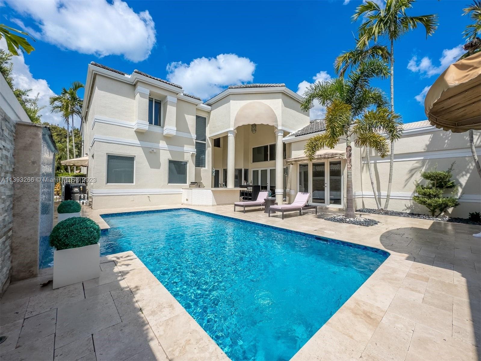 2707 Pinehurst Drive Weston, FL 33332 - Photo 5 of 59 a view of a house with swimming pool and sitting area