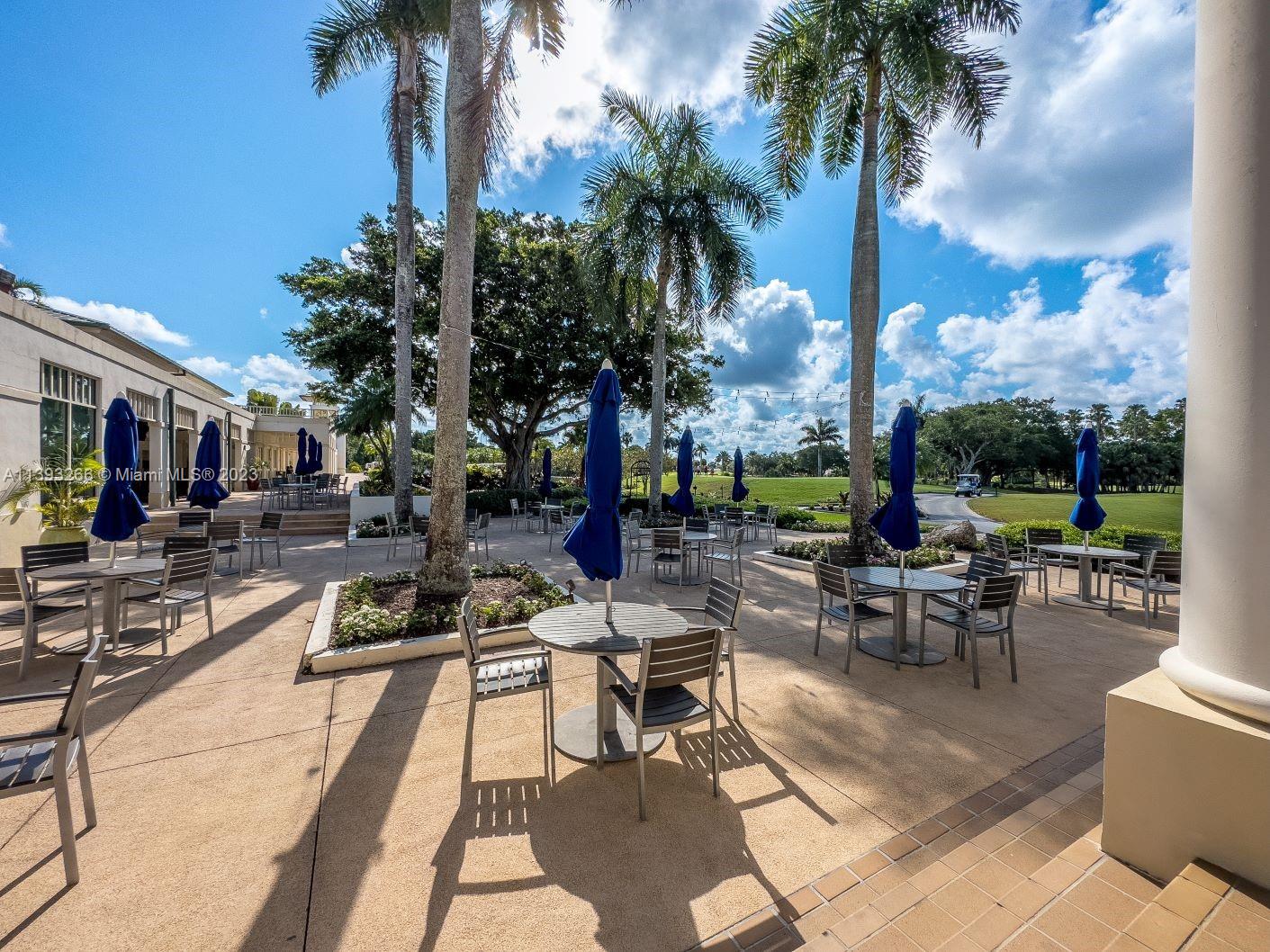 2707 Pinehurst Drive Weston, FL 33332 - Photo 53 of 59 a view of a patio with swimming pool and sitting area