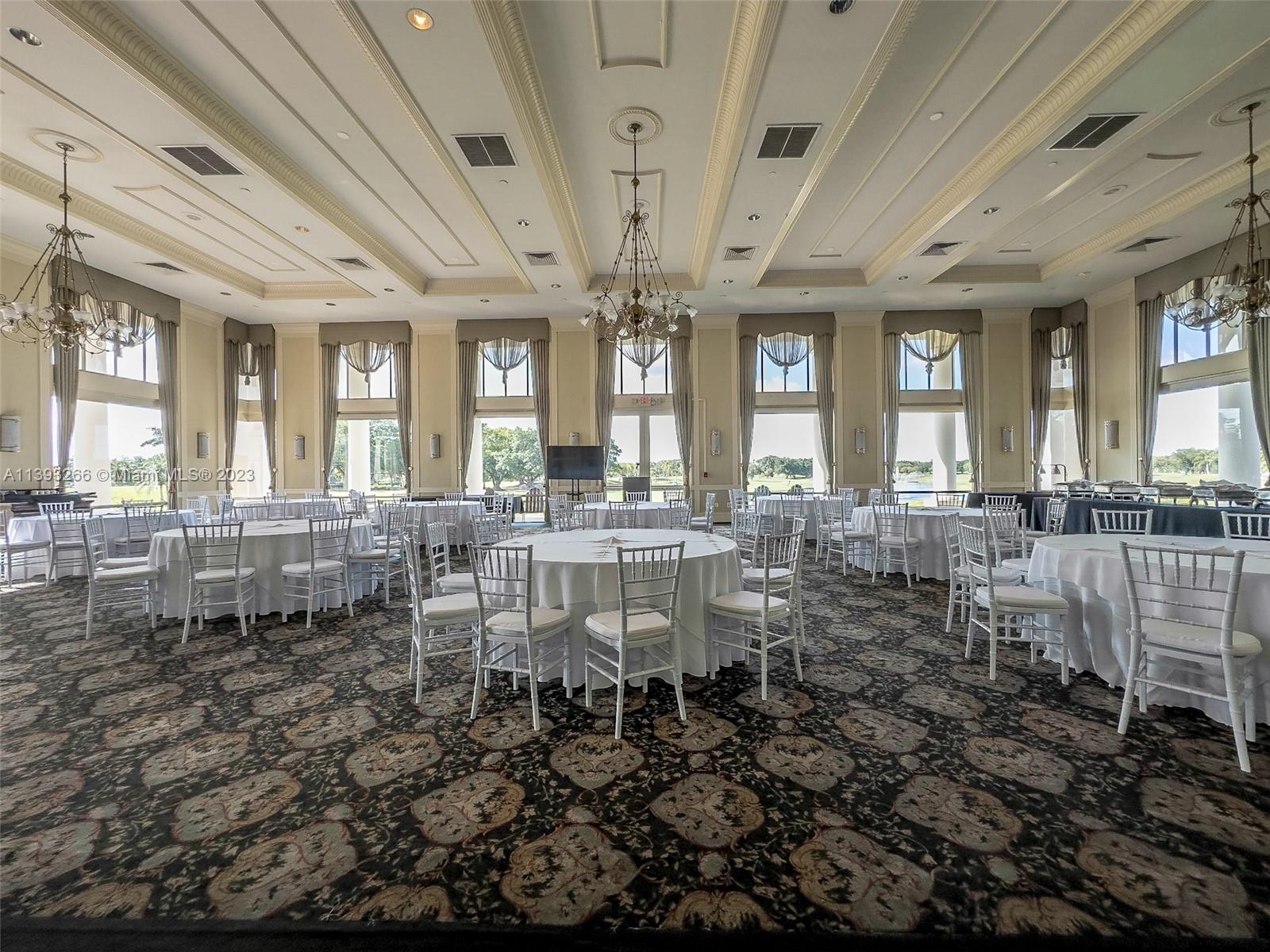 2707 Pinehurst Drive Weston, FL 33332 - Photo 55 of 59 a room with lots of wooden furniture and glass windows