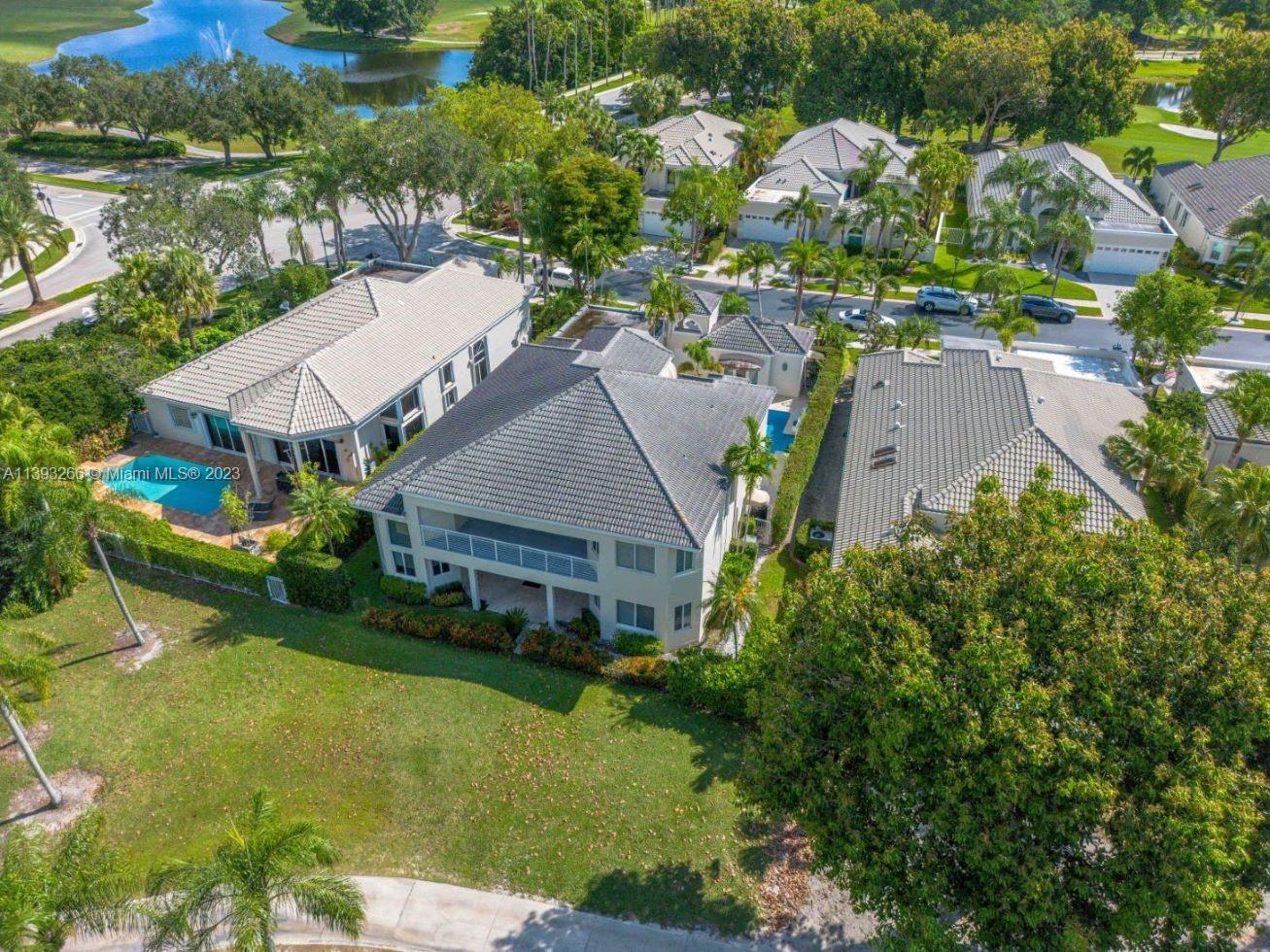 2707 Pinehurst Drive Weston, FL 33332 - Photo 59 of 59 an aerial view of multiple houses with yard
