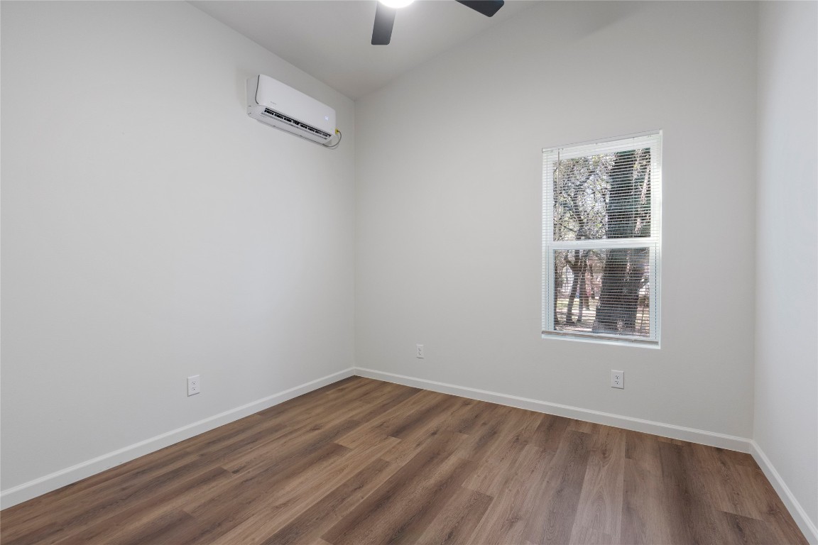 23081 Nameless Road, Unit D Leander, TX 78641 - Photo 12 of 16 an empty room with a window
