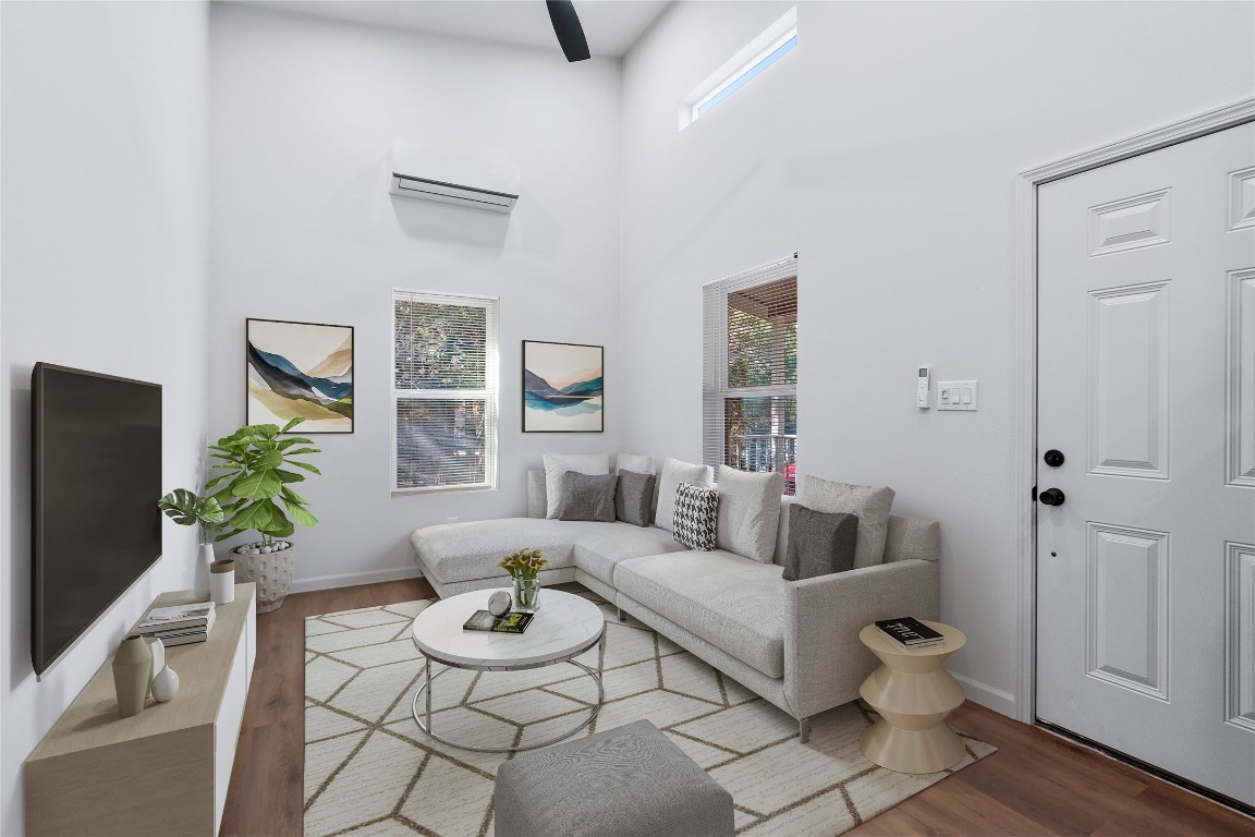 23081 Nameless Road, Unit D Leander, TX 78641 - Photo 3 of 16 a living room with furniture and wooden floor