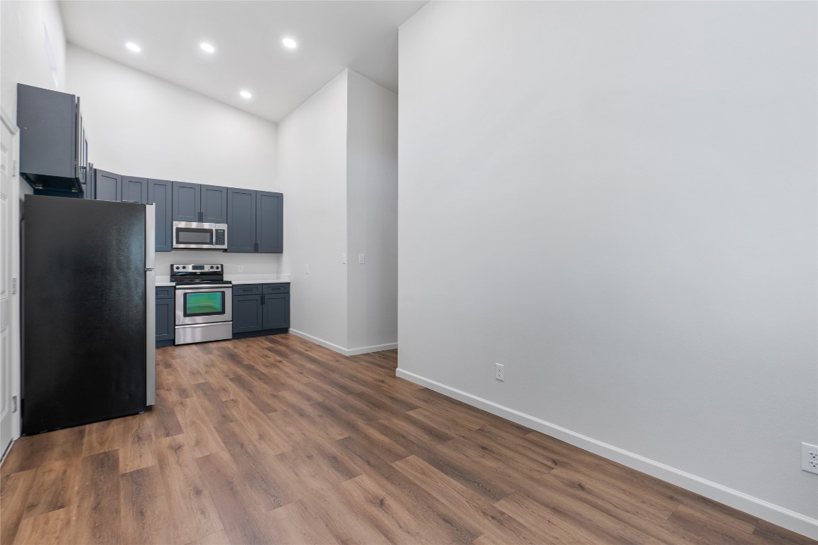 23081 Nameless Road, Unit D Leander, TX 78641 - Photo 8 of 16 a kitchen with stainless steel appliances a refrigerator and a stove top oven
