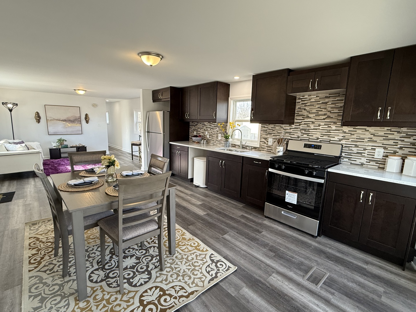 237 Blackthorn Road Matteson, IL 60443 - Photo 2 of 19 a kitchen with stainless steel appliances kitchen island granite countertop a sink and cabinets