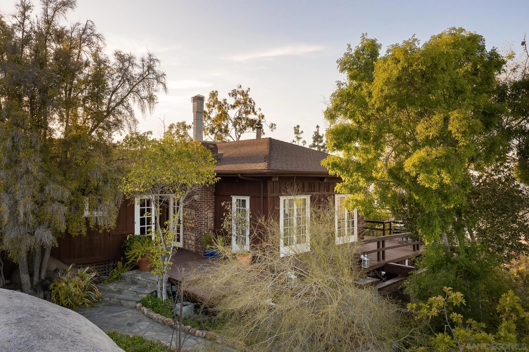 9844 Summit Drive La Mesa, CA 91941 - Photo 12 of 58 a front view of a house with a garden