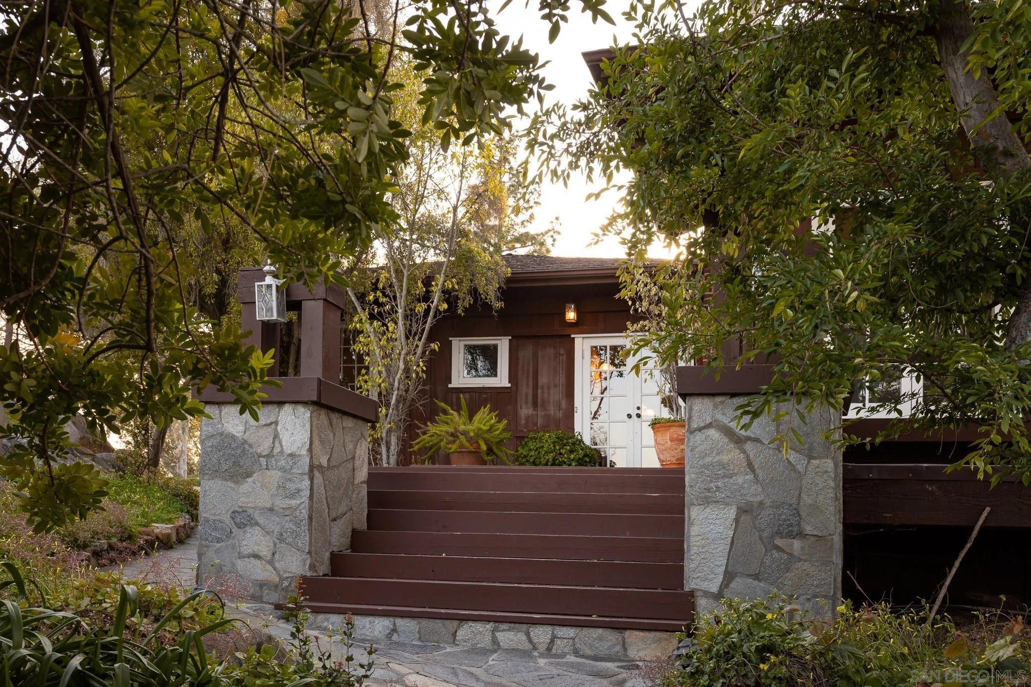 9844 Summit Drive La Mesa, CA 91941 - Photo 13 of 58 a front view of a house with a garden