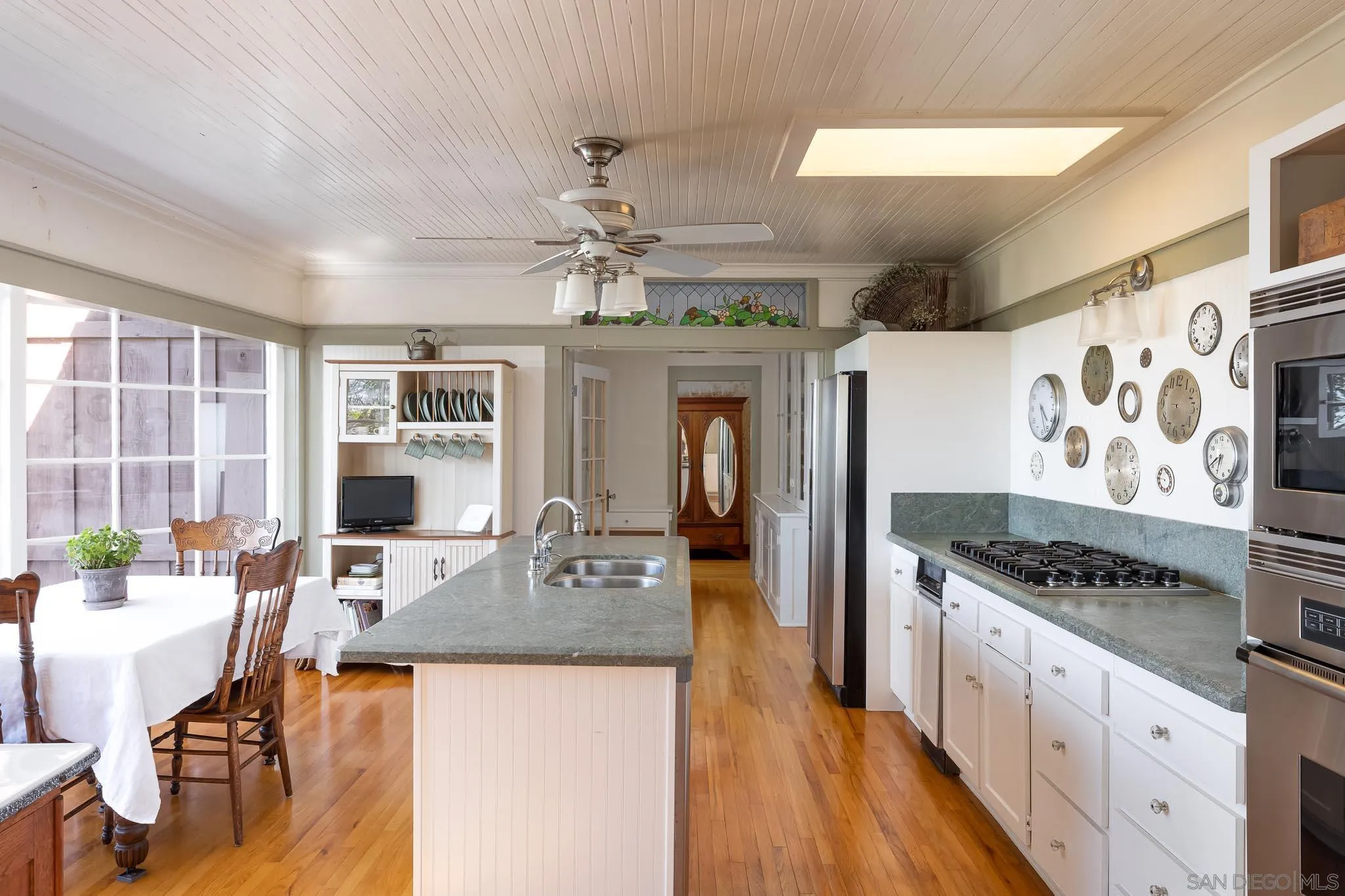9844 Summit Drive La Mesa, CA 91941 - Photo 28 of 58 a kitchen with stainless steel appliances granite countertop a stove oven and a refrigerator with white cabinets
