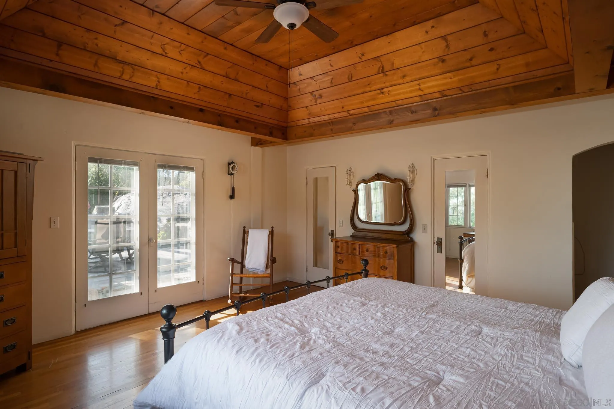 9844 Summit Drive La Mesa, CA 91941 - Photo 32 of 58 a bedroom with a bed and wooden floor