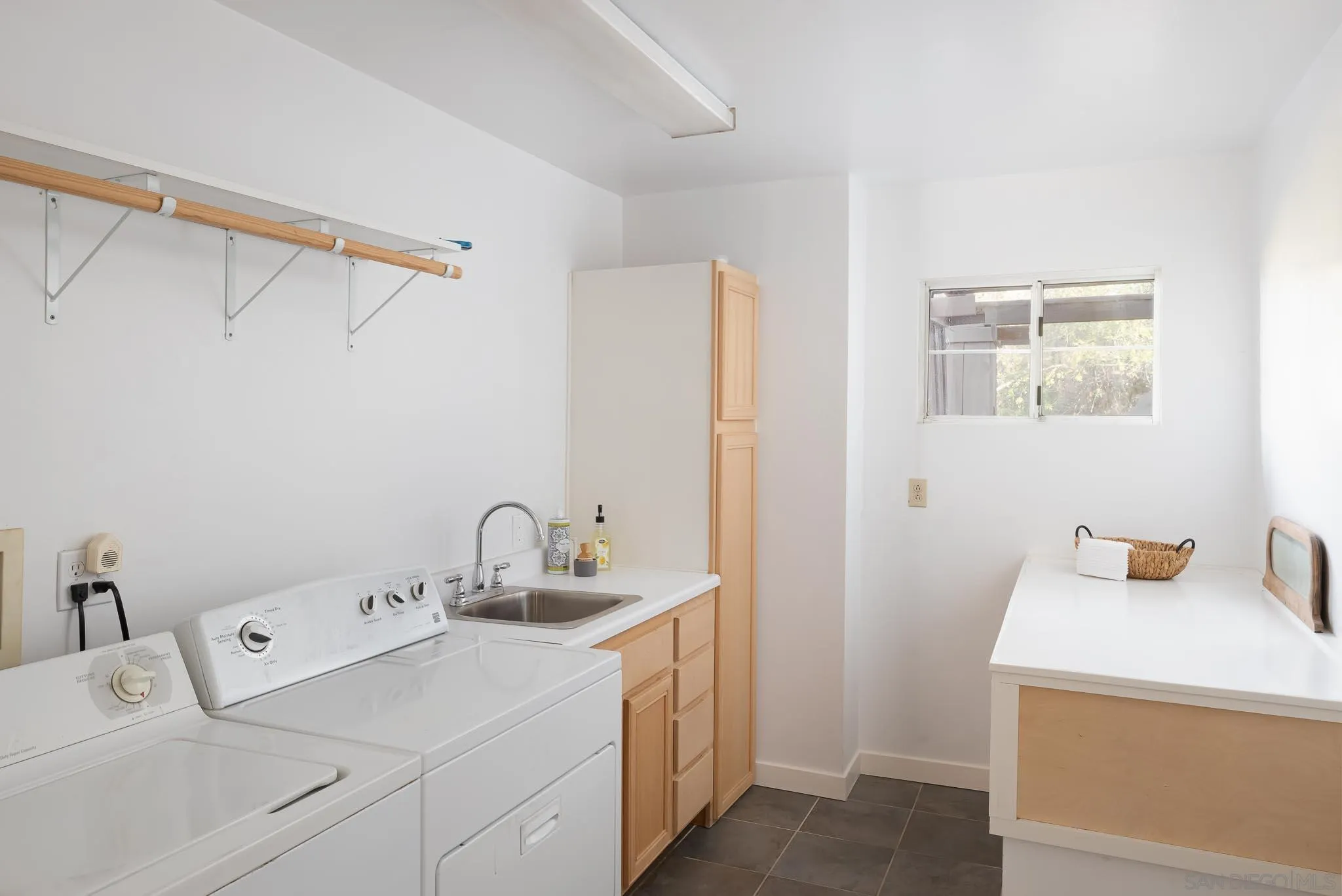 9844 Summit Drive La Mesa, CA 91941 - Photo 40 of 58 a bathroom with a sink and a mirror