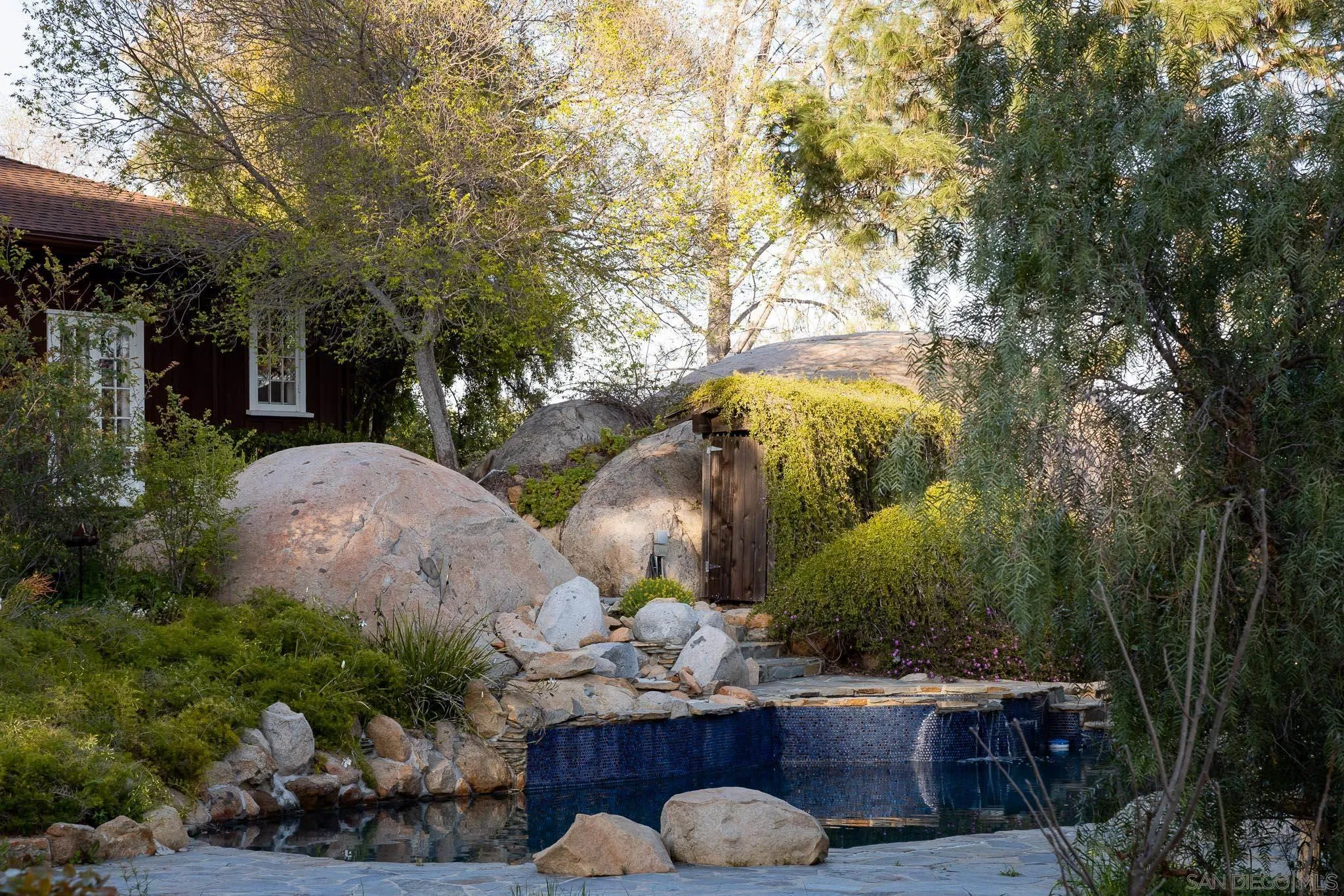9844 Summit Drive La Mesa, CA 91941 - Photo 44 of 58 a front view of a house with garden