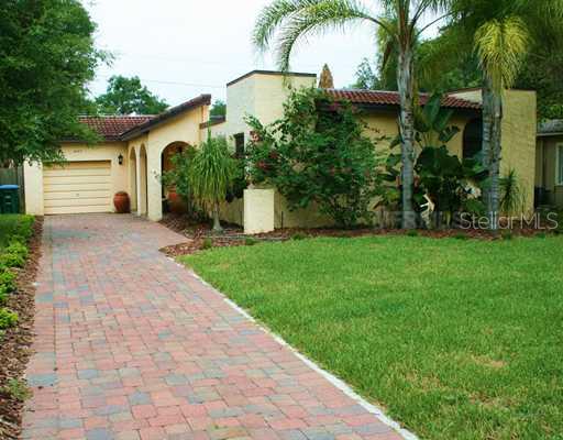 Exterior Front - Pavered driveway leads to this charming Spanish style Orwin Manor bungalow - new sod and sprinkler system makes for great curb appeal.
