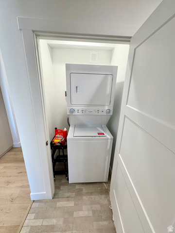 70 East Hwy 153, Unit A4 Beaver, UT 84713 - Photo 15 of 19 Laundry area with stacked washer and clothes dryer and light wood-style floors