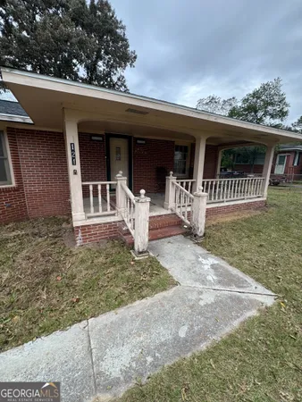 front view of a house with a yard