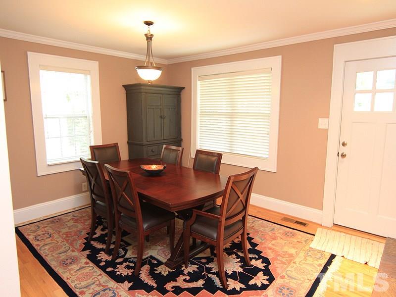 1630 Bickett Boulevard Raleigh, NC 27608 - Photo 4 of 18 a view of a dining room with furniture and window