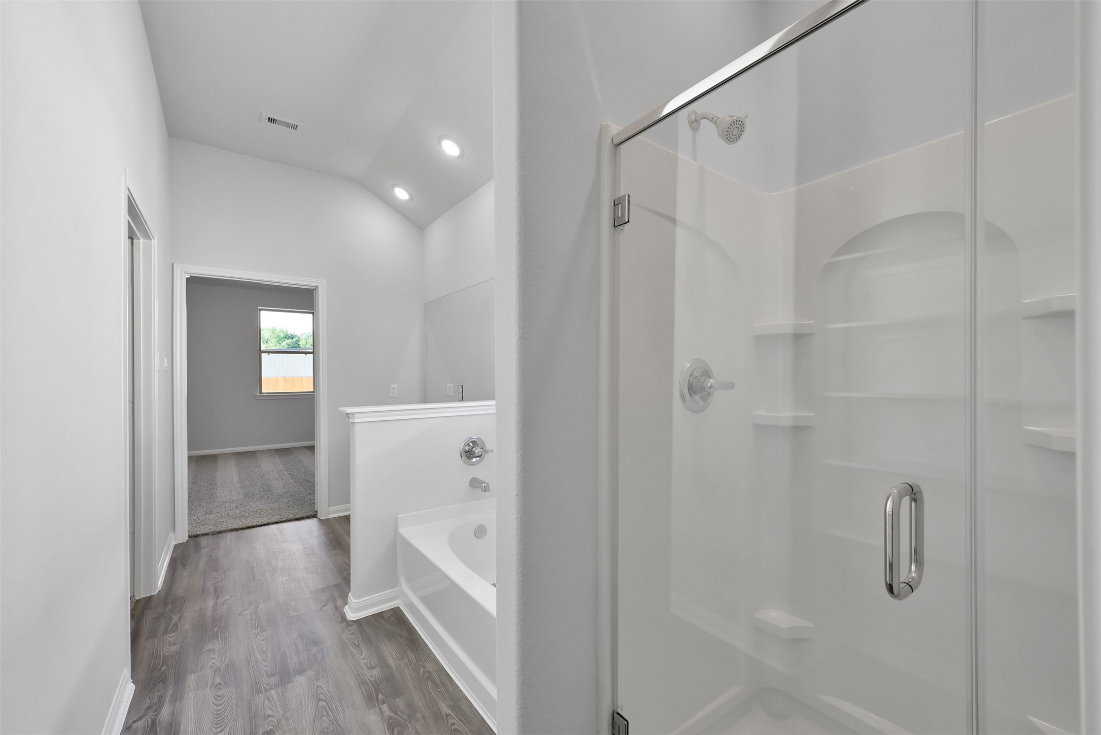 17620 Cedar Crest Drive Conroe, TX 77306 - Photo 11 of 15 a bathroom with a bathtub and a shower