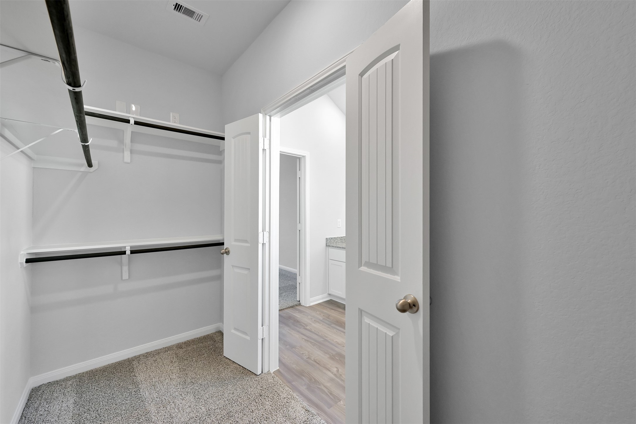 17620 Cedar Crest Drive Conroe, TX 77306 - Photo 12 of 15 a view of walk in closet with empty racks