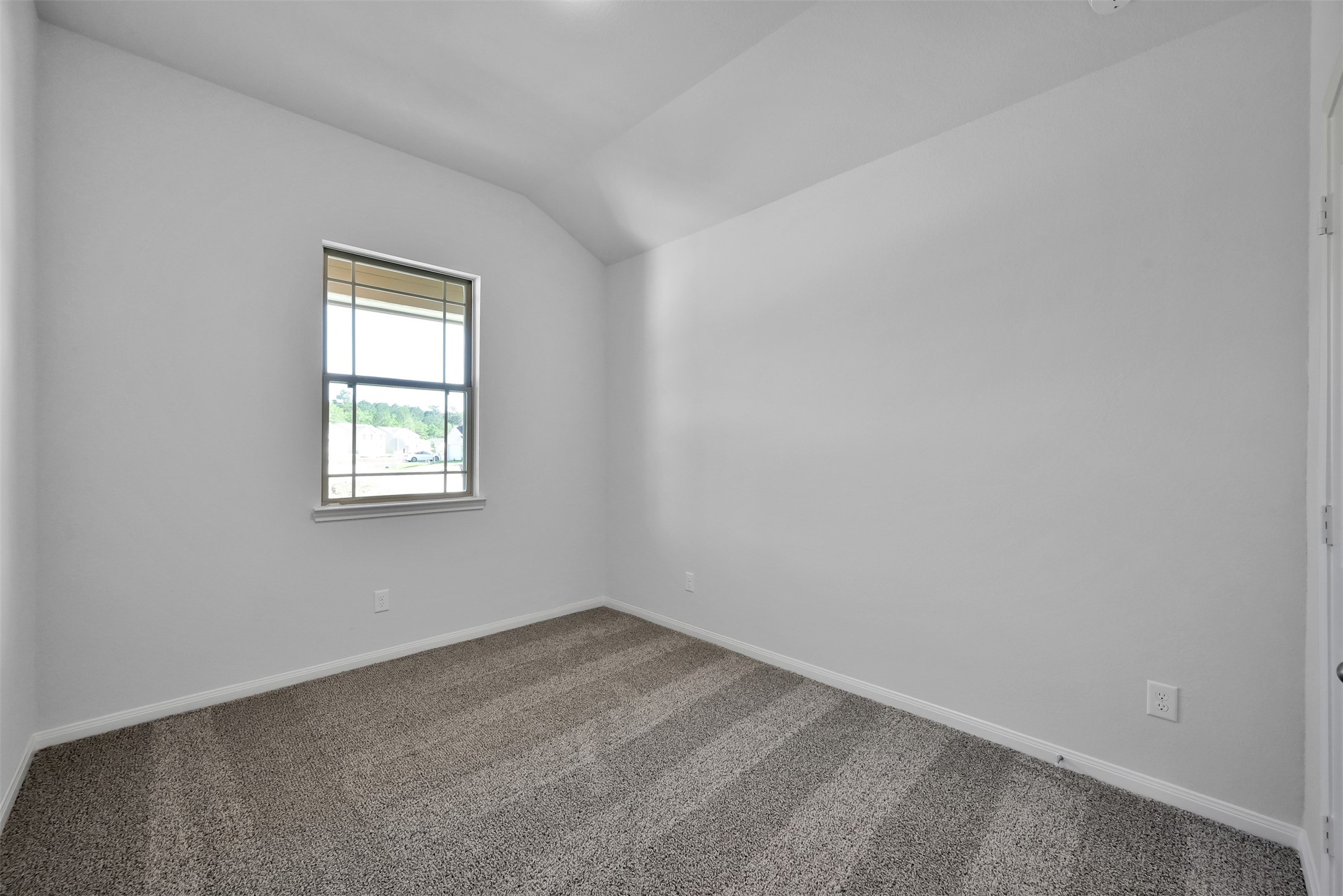 17620 Cedar Crest Drive Conroe, TX 77306 - Photo 13 of 15 an empty room with a window