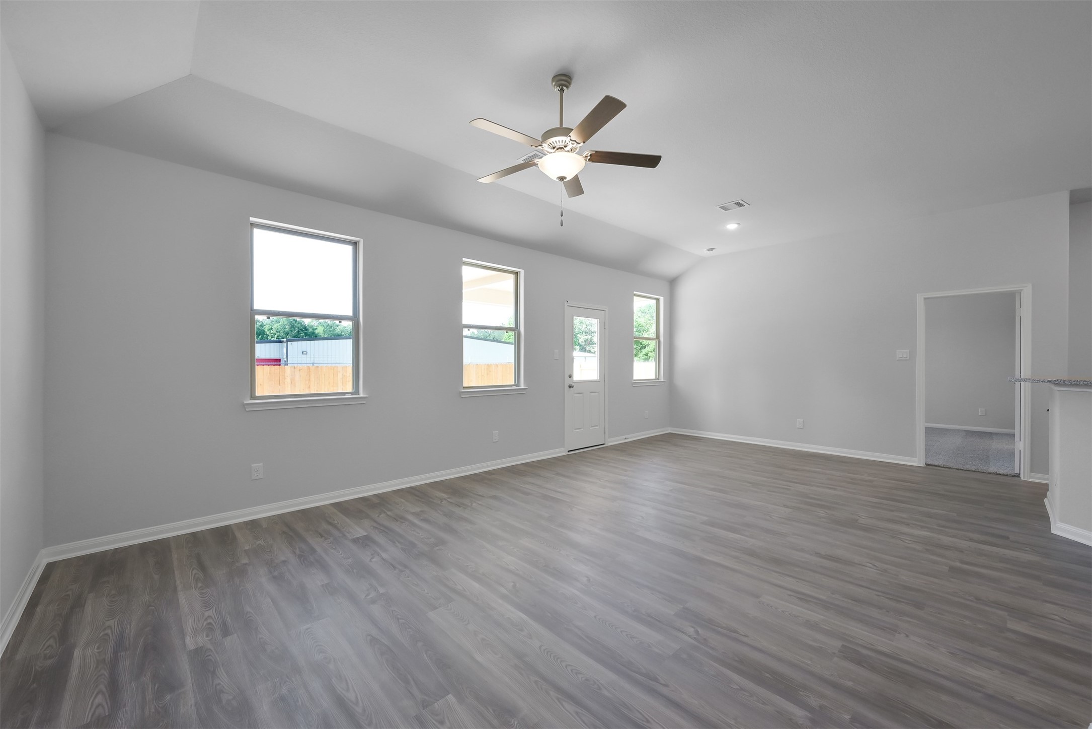 17620 Cedar Crest Drive Conroe, TX 77306 - Photo 7 of 15 a view of an empty room with wooden floor and a window