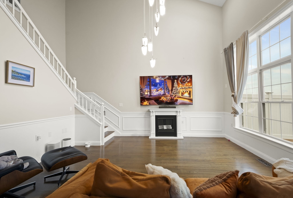 806 Ledgewood Way, Unit 806 Clinton, MA 01510 - Photo 11 of 42 a living room with furniture and a flat screen tv