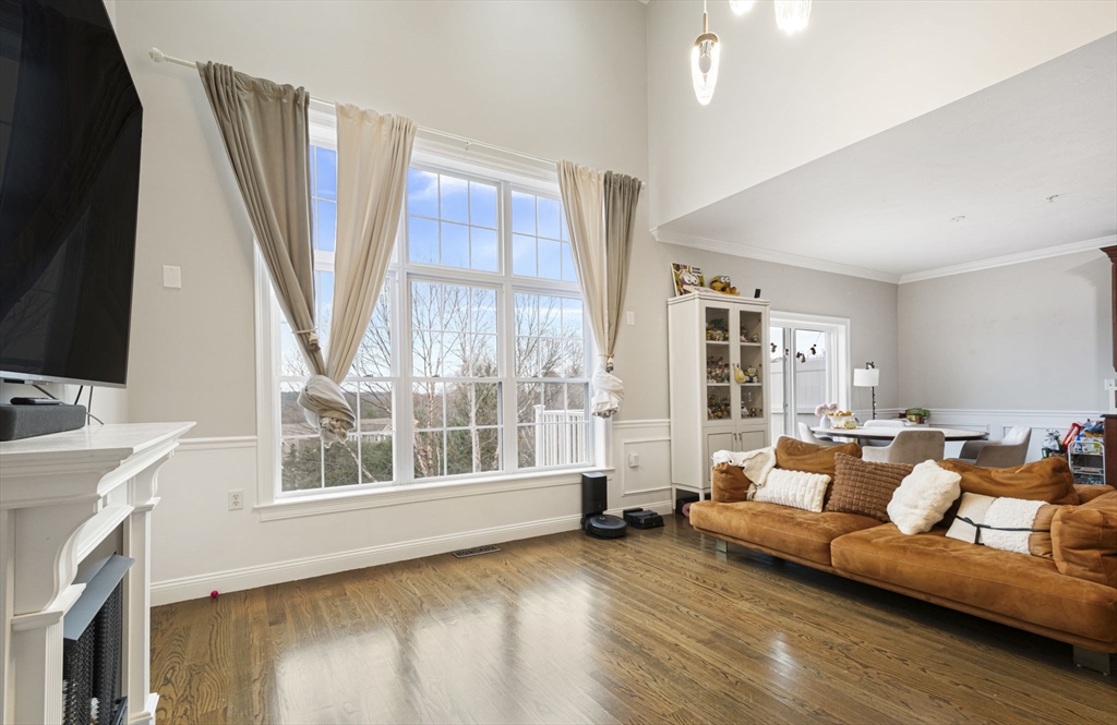 806 Ledgewood Way, Unit 806 Clinton, MA 01510 - Photo 13 of 42 a living room with furniture and a large window