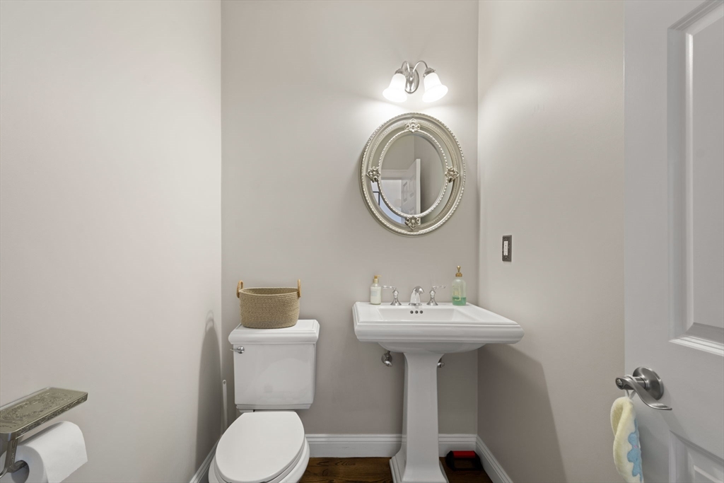 806 Ledgewood Way, Unit 806 Clinton, MA 01510 - Photo 21 of 42 a bathroom with a sink mirror toilet and vanity